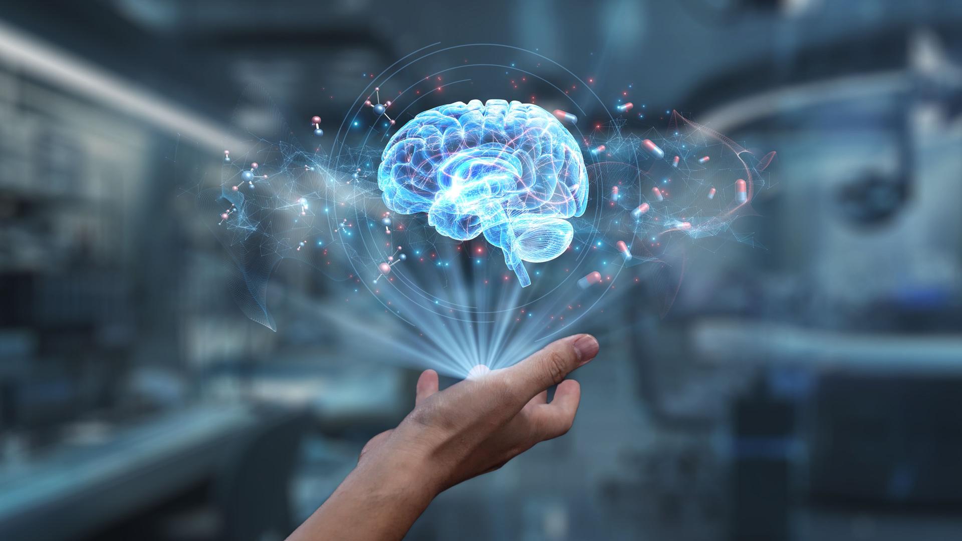 Close up of human hand holding brain holographic floating at lab. Salubrious.
