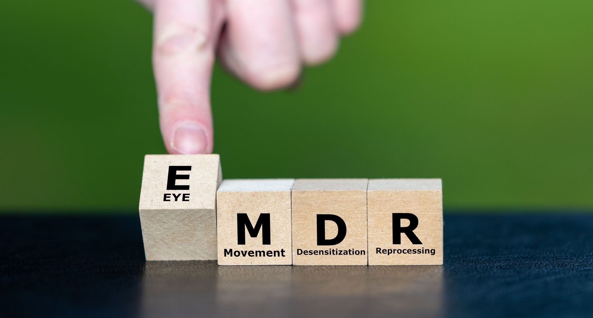 Cubes form the Expression EMDR, which stands for Eye Movement Desensitization and Reprocessing. EMDR is a psychotherapy treatment that is designed to alleviate the distress with traumatic memories.